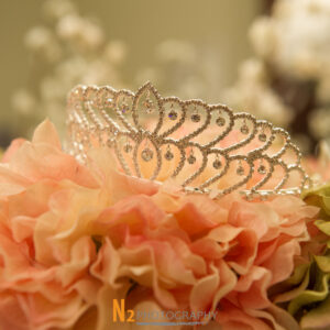 A photograph of a beautifully decorated tiara crown taken before a quinceañera at Alegria Gardens Reception Hall in Houston.