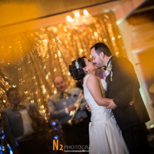 Couple kissing at our reception hall - Alegria Gardens