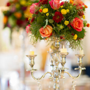Candle and flower center piece at our reception hall - Alegria Gardens