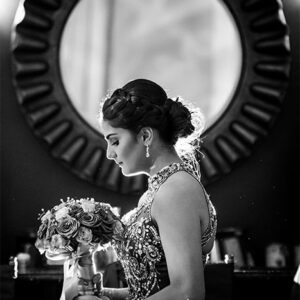 Girl looking at a bouquet at our party hall - Alegria Gardens