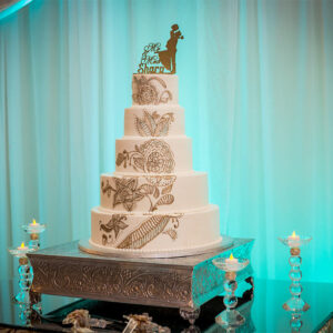 Wedding cake with floral designs at our reception hall - Aledgria Gardens