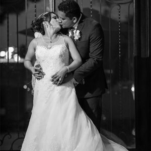 Just married couple kissing at our wedding venue - Alegria Gardens