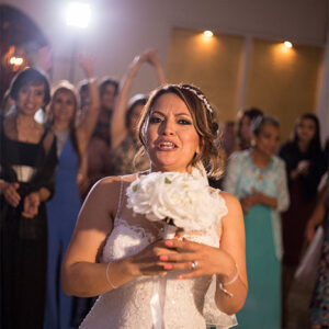 Bride throwing the bouquet at our receptin hall - Alegria Gardens