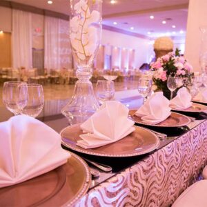 Plates and folded napkins at our wedding venue - Alegria Gardens