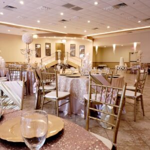 A picture featuring beautifully decorated tables and chairs inside of Alegria Gardens Reception Hall at Stacy in Houston.