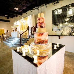 A picture featuring a large cake inside of the dining hall at Alegria Gardens at 529 in Houston.