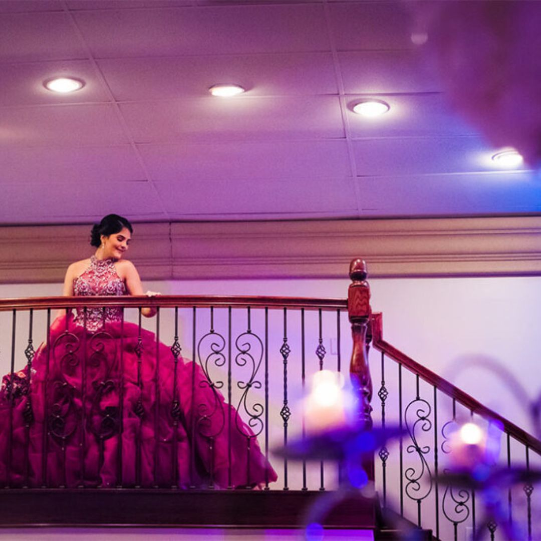 girl making a grand entrance in her Quinceanera dress