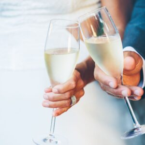 couple clinking champagne glasses