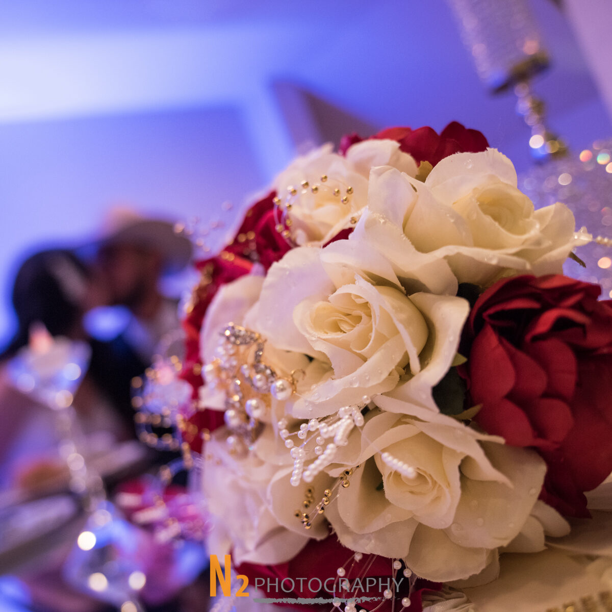 Red and white bouquet at our wedding venue - Alegria Gardens